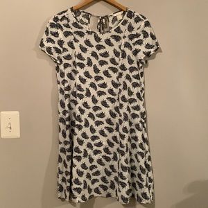 Back and white feather swing dress